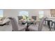 Close-up of dining table with modern setting in an open floor plan, next to the kitchen at 71 Ashworth Dr., Tabor City, NC 28463