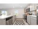 Well-lit kitchen with modern appliances, a spacious countertop, and stainless steel dishwasher at 71 Ashworth Dr., Tabor City, NC 28463