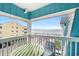 Balcony view overlooking a beach, with outdoor seating and views of the ocean at 720 North Waccamaw Dr. # 312, Murrells Inlet, SC 29576