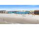 Aerial view of the building complex facing the beach, and ocean at 720 North Waccamaw Dr. # 312, Murrells Inlet, SC 29576