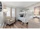 Bright bunk room with a white bunk bed, chair, light, and beach-themed decor at 720 North Waccamaw Dr. # 312, Murrells Inlet, SC 29576