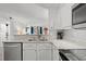 Open kitchen view with stainless steel appliances, stone countertops and bright lighting at 720 North Waccamaw Dr. # 312, Murrells Inlet, SC 29576