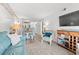 Spacious living room featuring cozy seating, a dining area and open kitchen at 720 North Waccamaw Dr. # 312, Murrells Inlet, SC 29576