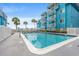 Community pool with ample sunlight and blue exterior building at 720 North Waccamaw Dr. # 312, Murrells Inlet, SC 29576