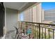 Spacious balcony features chairs and a view of the building, trees, and parking at 7200 N Ocean Blvd. N # 439, Myrtle Beach, SC 29572