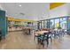 A restaurant area with bar and tables for seating with access to the outside view of the beach and playground at 7200 N Ocean Blvd. N # 439, Myrtle Beach, SC 29572