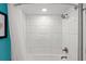 The walk-in shower features white marble-look tiling, a shower curtain, and a rainfall shower head at 7200 N Ocean Blvd. N # 439, Myrtle Beach, SC 29572