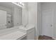 Bright bathroom with white vanity, sink, a large mirror, and a glass-enclosed shower at 808 Wild Leaf Loop, Conway, SC 29526
