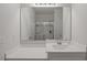 Bright bathroom with white vanity, sink, a large mirror, and a glass-enclosed shower at 808 Wild Leaf Loop, Conway, SC 29526