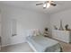 Well-lit bedroom showcases a comfortable bed, a decorative mirror, and a classic white dresser at 808 Wild Leaf Loop, Conway, SC 29526