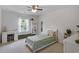 Bright bedroom featuring a cozy bed, window views, and a charming desk with coordinated decor at 808 Wild Leaf Loop, Conway, SC 29526