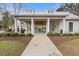 Community clubhouse featuring covered outdoor seating areas and a well-kept landscape at 808 Wild Leaf Loop, Conway, SC 29526