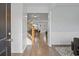 Welcoming foyer leads to a stylish living area with a view of the staircase and hardwood floors at 808 Wild Leaf Loop, Conway, SC 29526