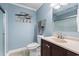 Bathroom features a dark wood vanity with a stone countertop and a sliding glass shower door at 811 N Ocean Blvd. # 401, Surfside Beach, SC 29575