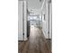 View of hallway with wood floors leading to the living space with an ocean view at 811 N Ocean Blvd. # 401, Surfside Beach, SC 29575