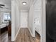 Hallway with wood-look flooring leading to bedrooms at 811 N Ocean Blvd. # 401, Surfside Beach, SC 29575