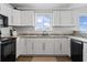Bright kitchen area with updated countertops, cabinets, appliances and a window view at 811 N Ocean Blvd. # 401, Surfside Beach, SC 29575