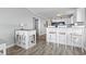 Eat-in kitchen featuring a breakfast bar, granite countertops, and white cabinetry at 811 N Ocean Blvd. # 401, Surfside Beach, SC 29575