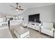 Open concept living space with modern furnishings, a flat-screen TV, and a view of the kitchen area at 811 N Ocean Blvd. # 401, Surfside Beach, SC 29575