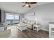 Bright living room with stylish furniture and a sliding glass door leading to a balcony with ocean views at 811 N Ocean Blvd. # 401, Surfside Beach, SC 29575