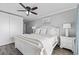 Bright and airy main bedroom with a ceiling fan, wood-look floors, and plenty of storage at 811 N Ocean Blvd. # 401, Surfside Beach, SC 29575