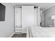 Spacious walk-in closet with custom shelving and sliding doors in the main bedroom at 811 N Ocean Blvd. # 401, Surfside Beach, SC 29575