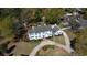 Aerial view of a stately white home with a circular driveway and meticulously landscaped grounds at 817 Evans Rd., Marion, SC 29571