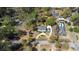 Aerial view showcasing a home's landscaped lot, complete with gardens and a circular driveway at 817 Evans Rd., Marion, SC 29571