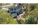 Overhead view of a large white home with manicured gardens, brick pathways, and verdant trees at 817 Evans Rd., Marion, SC 29571