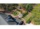An aerial view showcasing the lush garden with pergola, water feature, and garden shed at 817 Evans Rd., Marion, SC 29571