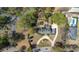 An aerial view of a stately home, circular drive, and lush surrounding landscape at 817 Evans Rd., Marion, SC 29571