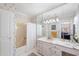 Elegant bathroom with a marble vanity, bathtub, and decorative wallpaper at 817 Evans Rd., Marion, SC 29571