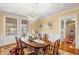 Formal dining room with hardwood floors, vintage rug, and ornate chandelier at 817 Evans Rd., Marion, SC 29571