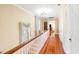 Upstairs hallway with hardwood floors and natural light from the window at 817 Evans Rd., Marion, SC 29571