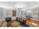 Comfortable living room with a crystal chandelier, leather sofas, and detailed rug at 817 Evans Rd., Marion, SC 29571