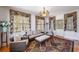 Comfortable living area featuring hardwood floors, decorative chandelier and neutral decor at 817 Evans Rd., Marion, SC 29571