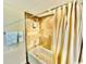 Bathroom featuring a tiled shower, bathtub with curtain, and towel rack at 8560 Queensway Blvd. # 304, Myrtle Beach, SC 29572