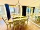 Dining area with seating for six, large windows, and ocean views at 8560 Queensway Blvd. # 304, Myrtle Beach, SC 29572