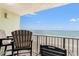 Balcony with chairs offering stunning ocean views, great for outdoor relaxation at 9400 Shore Dr. # 725, Myrtle Beach, SC 29572