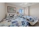 Comfortable bedroom featuring two twin beds with seashell-themed bedding and a ceiling fan at 9400 Shore Dr. # 725, Myrtle Beach, SC 29572
