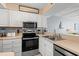 Modern kitchen featuring stainless steel appliances, white cabinets, and ample counter space at 9400 Shore Dr. # 725, Myrtle Beach, SC 29572