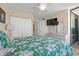 Spacious primary bedroom with a ceiling fan, large closet, and balcony access at 9400 Shore Dr. # 725, Myrtle Beach, SC 29572