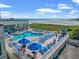 Stunning pool with lounge chairs with beach views in background at 9400 Shore Dr. # 725, Myrtle Beach, SC 29572