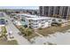 Aerial view showing the condo building, community pool, and proximity to the beach at 9620 Shore Dr. # 307, Myrtle Beach, SC 29572