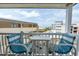 Inviting balcony features seating and scenic views of the ocean and nearby pool at 9620 Shore Dr. # 307, Myrtle Beach, SC 29572