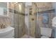 Bathroom featuring a glass-enclosed shower and stylish tile work, providing a modern and clean space at 9620 Shore Dr. # 307, Myrtle Beach, SC 29572