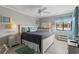 Cozy bedroom featuring soothing colors and a comfortable queen-size bed with coastal-themed decor at 9620 Shore Dr. # 307, Myrtle Beach, SC 29572