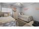 Charming bedroom featuring twin beds, coastal decor, and a soothing, beach-inspired color palette at 9620 Shore Dr. # 307, Myrtle Beach, SC 29572