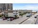 View of an attractive condo complex with a swimming pool and ample parking at 9620 Shore Dr. # 307, Myrtle Beach, SC 29572