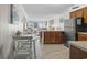 Open living and dining area with tiled floors and stainless steel refrigerator at 9620 Shore Dr. # 307, Myrtle Beach, SC 29572